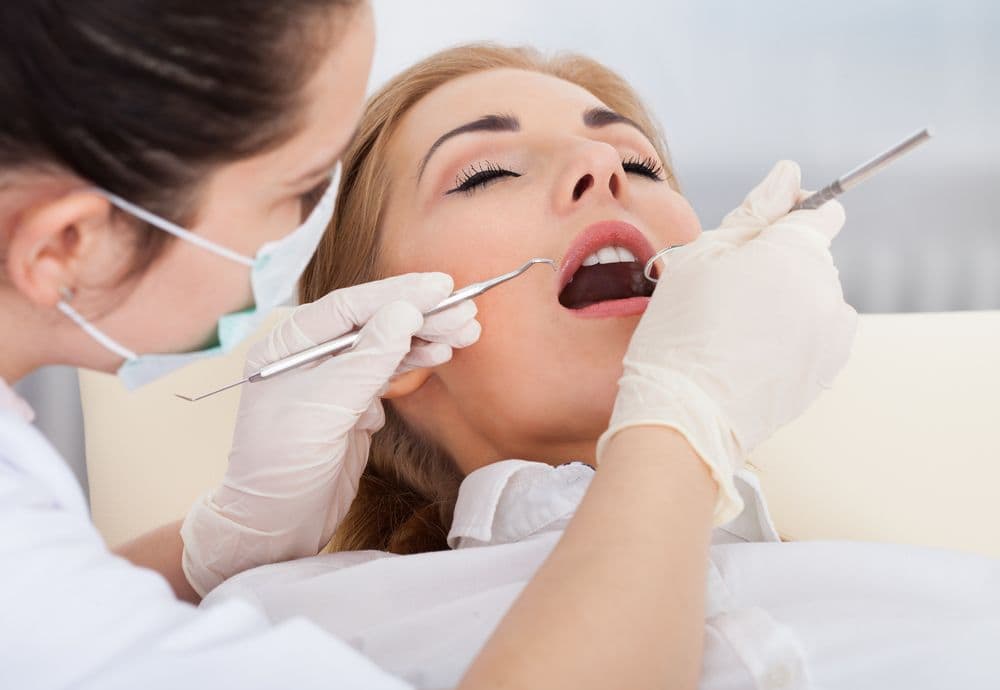 A nervous dental patient in Long Beach, CA, receiving sedation dentistry treatment
