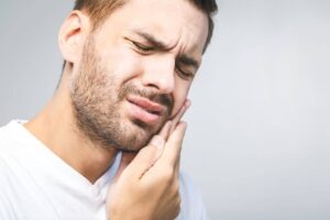 Young man suffers from jaw discomfort in Long Beach, CA